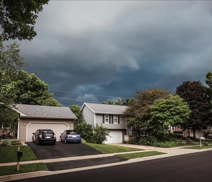 Thunderstorm clouds over a suburban neighborhood